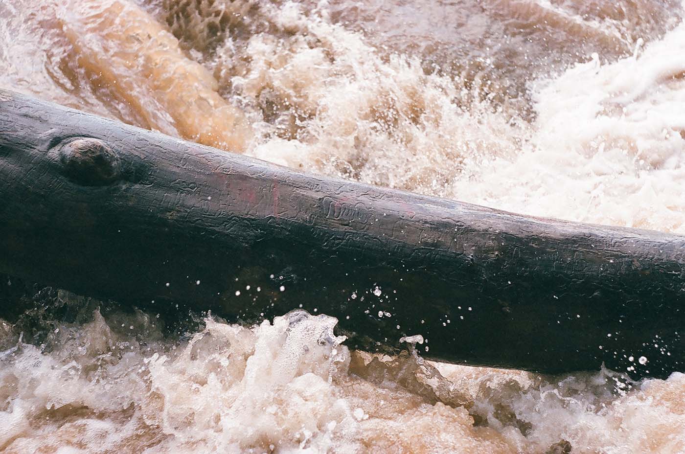 Large log in white water