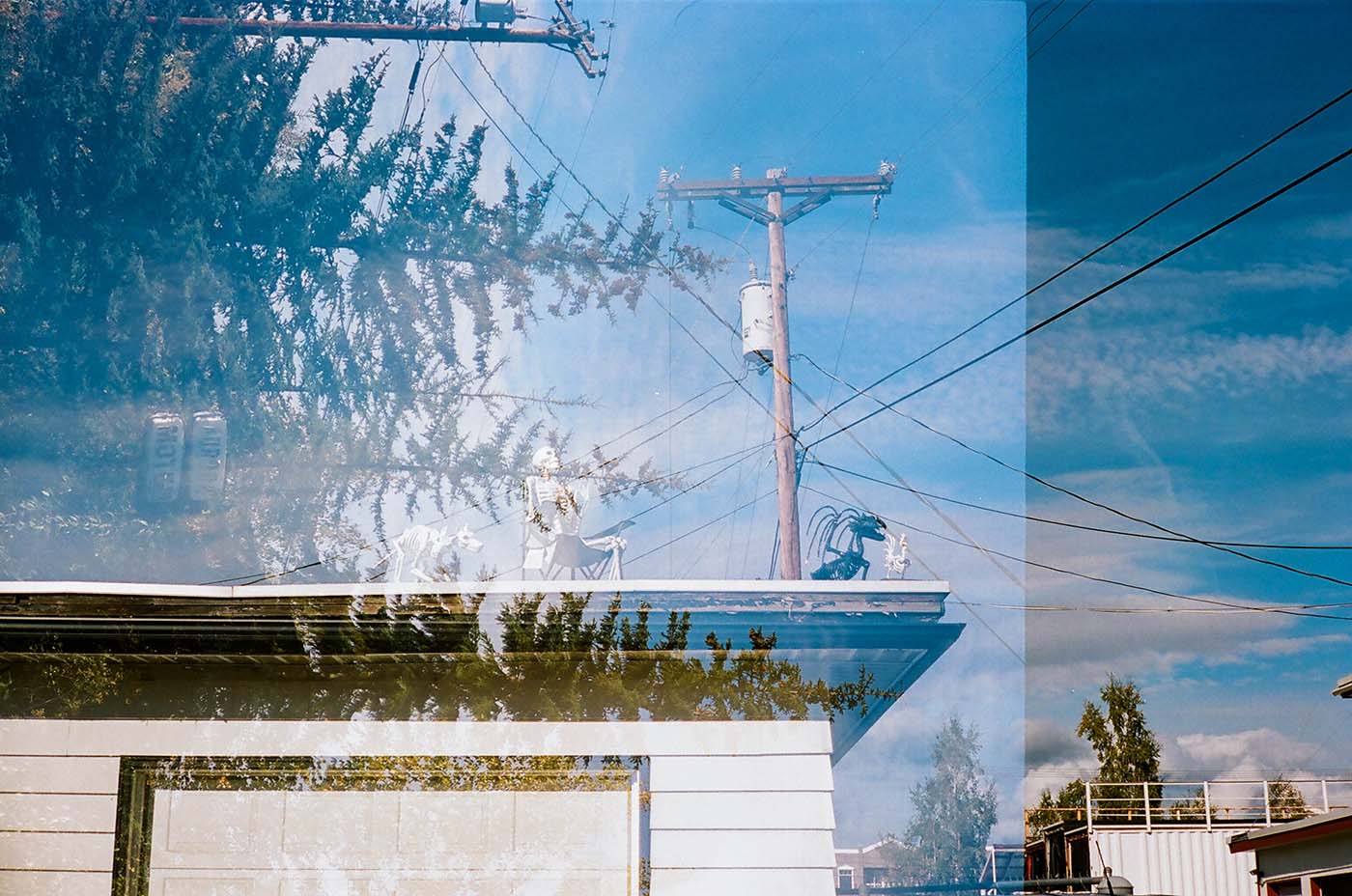 Strange photograph with double exposure, Halloween skepetons on a rooftop