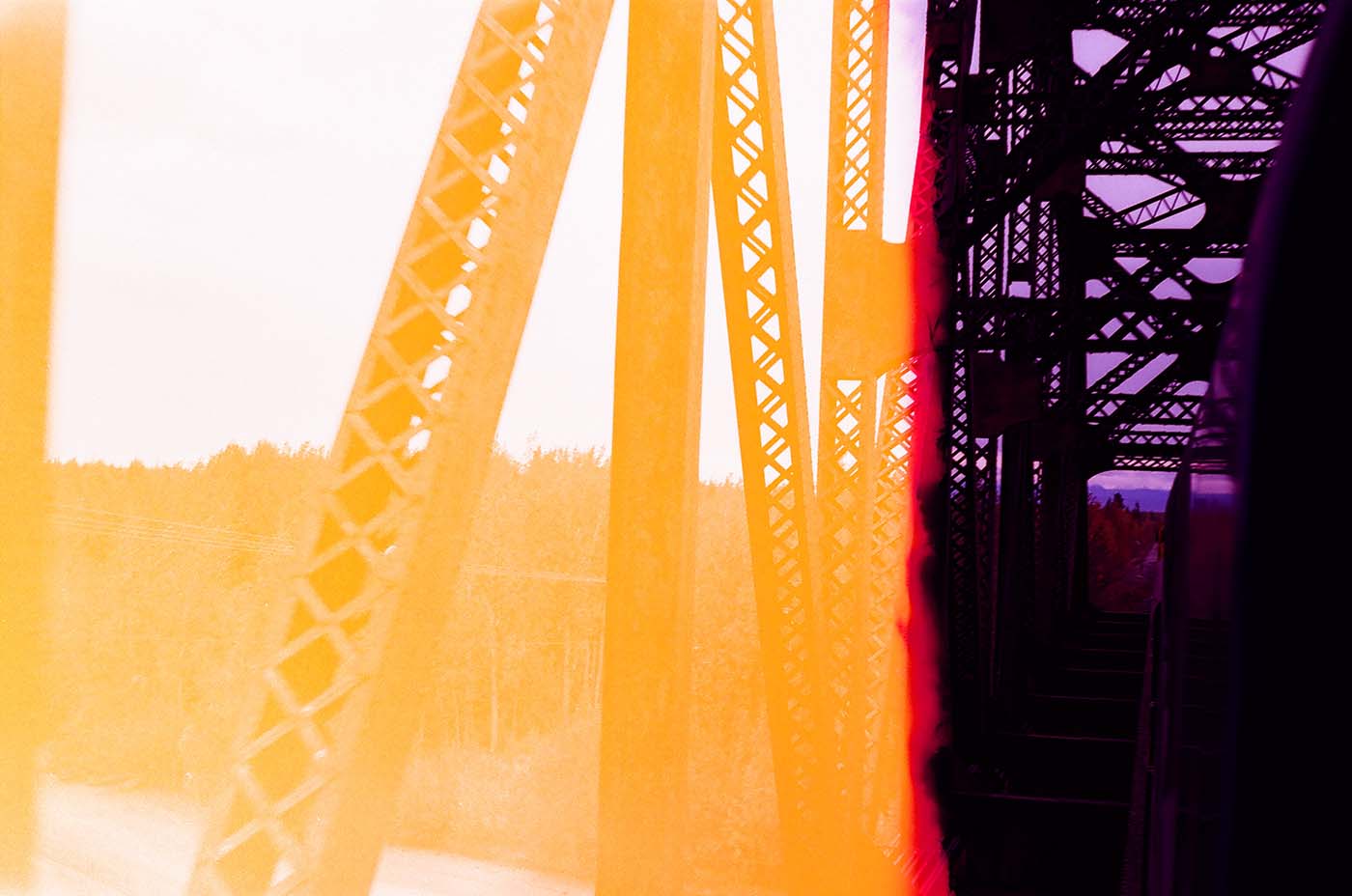 Old, iron bridge structure and dramatic light leak